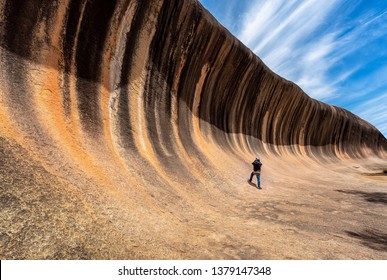 Traveller take photo a Wave rock park in Perth city, Australia, popular place for park, backpack and holiday