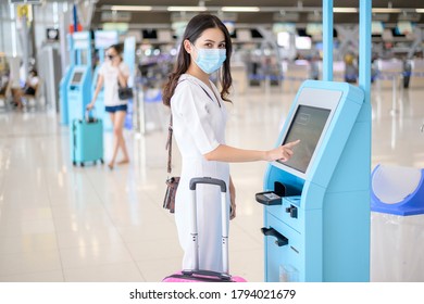 A Traveller Woman Is Wearing Protective Mask In International Airport, Travel Under Covid-19 Pandemic, Safety Travels, Social Distancing Protocol, New Normal Travel Concept .