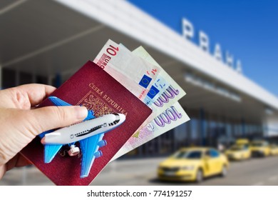 travelling by air - passport and foreign money in the hand - Vaclav Havel International airport, Ruzyne, Czech republic 