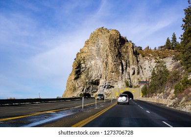 Travelling On The Shoreline Of Lake Tahoe On A Sunny Winter Day, Cave Rock Visible In The Background; Nevada