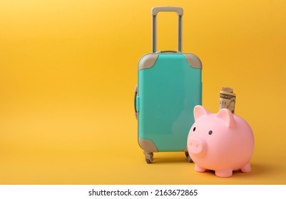 Travel.Vacation money saving concept,piggy bank beach vacation.Miniature luggage and bundles of hundred dollar bills.Vacations.Copy space.Savings concept for vacation. - Shutterstock ID 2163672865