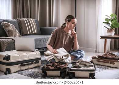 Travel,woman packing luggage in suitcase and planning solo trip eco friendly,travel banner and packing suitcase	 - Powered by Shutterstock