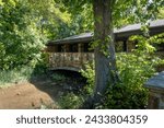 Travertine Nature Center at Chickasaw National Recreation Area straddles Travertine Creek. Built for former Platt National Park with rock work and architectural lines in style of Frank Lloyd Wright.