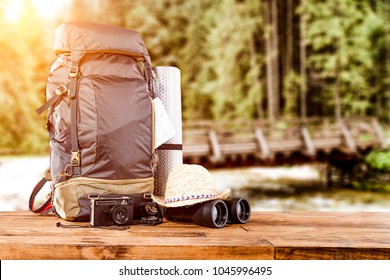Travle backpack and river with forest 