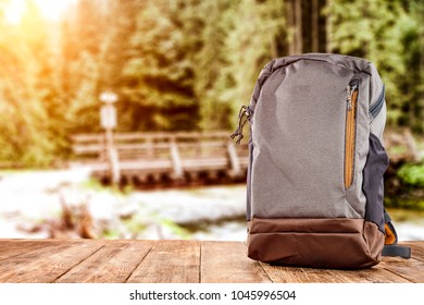 Travle backpack and river with forest 