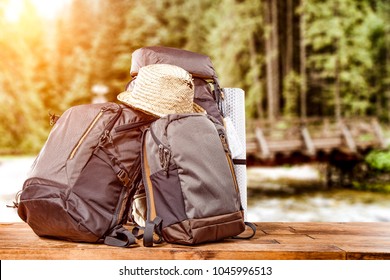 Travle backpack and river with forest 