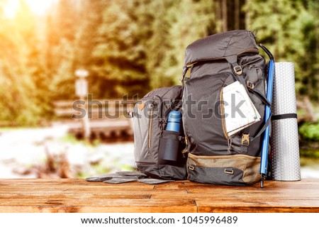 Travle backpack and river with forest 