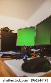 Travnik, Bosnia And Herzegovina - April 23, 2021: Green Screen On The Computer On Messy Desk In Room With Keyboard And Mouse