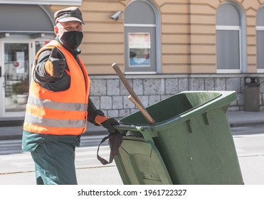 Travnik, Bosnia And Herzegovina - April 24, 2021: A Utility Worker Cleans The City On World Earth Day With A Mask On His Face.