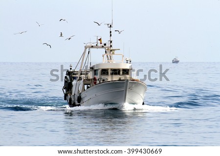 Trawler fishing boat sailing in open waters