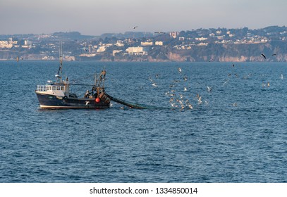 Trawler Fishing Vessel Heading Back To Port With Nets. Brixham, Devon, UK