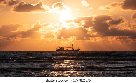 Trawler On The North See Coast During Beautiful Golden Sunset