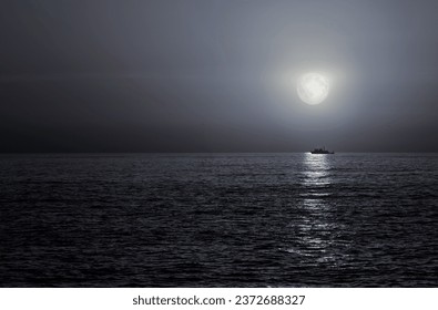 Trawler sailing on full moon night and sparkling sea