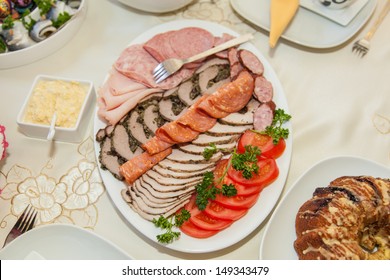 Tray of assorted meats on Easter table.
