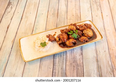 Tray Of Boneless Wings Stewed With Barbecue Sauce And A Little Russian Salad To Nibble On