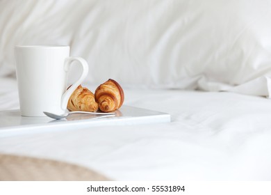 Tray with breakfast on a bed - Powered by Shutterstock