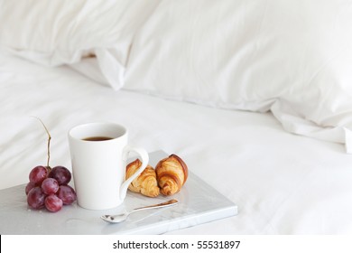 Tray with breakfast on a bed - Powered by Shutterstock