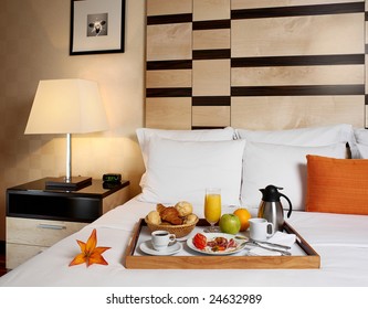 Tray With Breakfast On A Bed In A Hotel Room