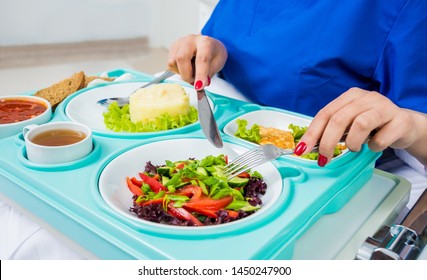 Tray with breakfast for the young female patient. The young woman eating in the hospital. Hospital food concept - Powered by Shutterstock