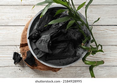 Tray With Charcoal On White Wooden Table, Top View