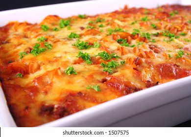 A Tray Of Colorful Freshly Cooked Pasta Bake With Parsley Garnish Straight From The Oven Shot An An Angle