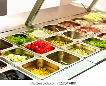 Tray With Cooked Food On Showcase At Cafeteria.