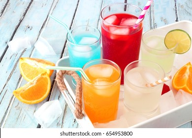 Tray Of Cool Colorful Summer Drinks Against A Rustic Wood Background