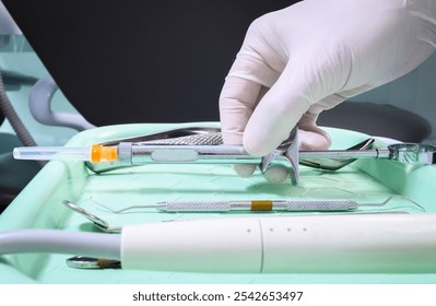 tray of dentistry elements. Hand of dentist taking anesthesia syringe for dentistry. Dentistry anesthesia medication. Local anesthesia. Instrumental dentistry tray. Closed angle, close-up. - Powered by Shutterstock