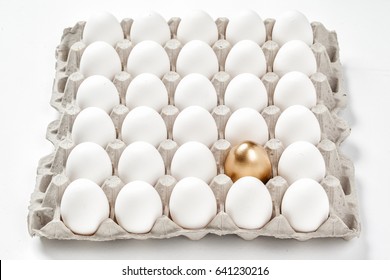 Tray of eggs with golden eggs - Powered by Shutterstock