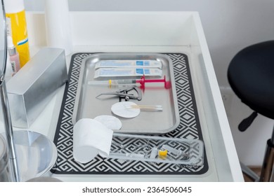 Tray with equipment and syringes to apply hyaluronic acid treatment in a beautician clinic - Shutterstock ID 2364506045