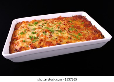 A Tray Of Freshly Cooked Pasta Bake Isolated On An Angle