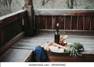 A Tray Full Of Traditional Georgian Food: Cheese, Bread, Greens And Wine.