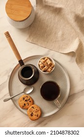 Tray With Glass Cup Of Coffee, Sugar, Cookies And Turkish Pot On White Marble Table, Flat Lay