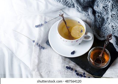 Tray With Honey And A Cup Of Hot Tea In The Bed, Lazy Morning, Warm Winter Mood