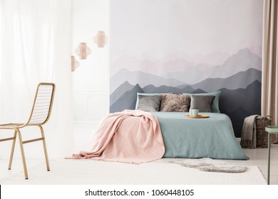 Tray With Mugs On A Cozy, Blue Bed With A Pastel Pink Blanket By A Landscape Wallpaper In A Bright Bedroom Interior