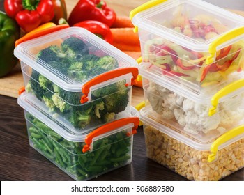 Trays with raw vegetables for freezing. Stocking up for winter storage in plastic containers