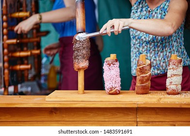 Trdelnik is street food of Prague. Three types of trdelnik with different sprinkling are ready to eat