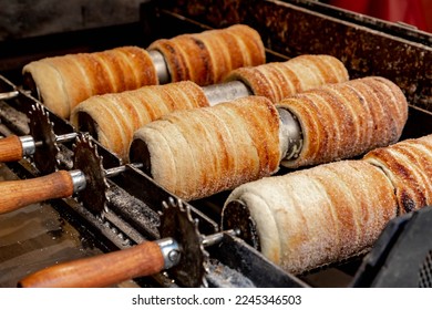 Trdelnik (Trdelník) or trdlo on a showcase shop, Kind of spit cake it is made from rolled dough that is wrapped around a stick then grilled and topped with sugar and walnut mix, Prague, Czech Republic