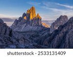 Tre Cime di Lavaredo, Drei Zinnen three peaks towers the symbol of the Dolomites. Beautiful mountain peaks towering above the valley in Dolomiti Alps