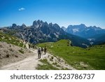 Tre Cime di Lavaredo, Italy-Jul 30 2024: People Activity, trekking around Tre Cime di Lavaredo in summertime, in the Sexten Dolomites of northeastern Italy, best-known mountain groups in the Alps