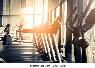 Treadmill In Fitness Room Background With Color Tone And Light Flare Effect