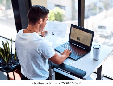 Treadmill, man and laptop in office for online project, creative business and paperwork report. Male person, proposal and document for productivity notes of company, development and research - Powered by Shutterstock