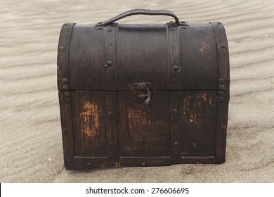 Treasure Chest In Sand Dunes On A Beach