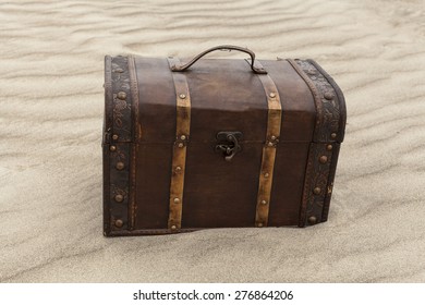 Treasure Chest In Sand Dunes On A Beach