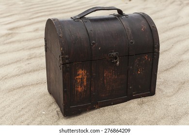 Treasure Chest In Sand Dunes On A Beach