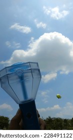 Treasure official fan lightstick with sky background