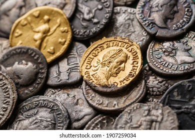 A treasure of Roman gold and silver coins.Trajan Decius. AD 249-251. AV Aureus.Ancient coin of the Roman Empire.Authentic  silver denarius, antoninianus,aureus of ancient Rome.Antikvariat. - Powered by Shutterstock