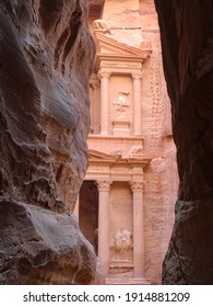 The Treasury behind al-Siq rock wall walkaway (Al-Khazneh) - Shutterstock ID 1914881209