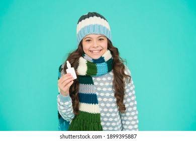 Treat Runny Nose With Drops. Free Your Stuffy Nose. Happy Teen Girl In Knitwear Hold Nasal Spray. Kid Winter Fashion Style. Child Care Of Health. Coronavirus Pandemic Quarantine. Healthy Childhood.