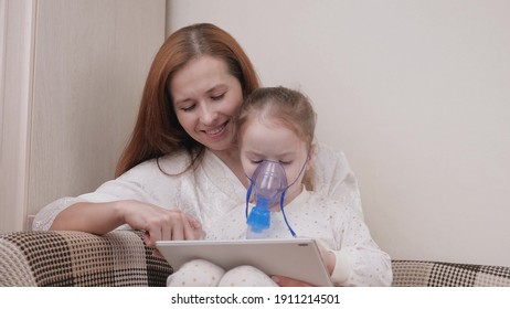 Treat your child for colds at home. Mom treats her daughter with inhalation and together they watch cartoons on tablet. Child is receiving respiratory therapy with nebulizer. Child suffers from cough. - Powered by Shutterstock